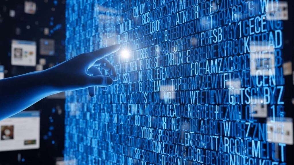 Mão apontando para um painel com letras e números brilhantes em azul, evocando interação com dados ou sistema digital.